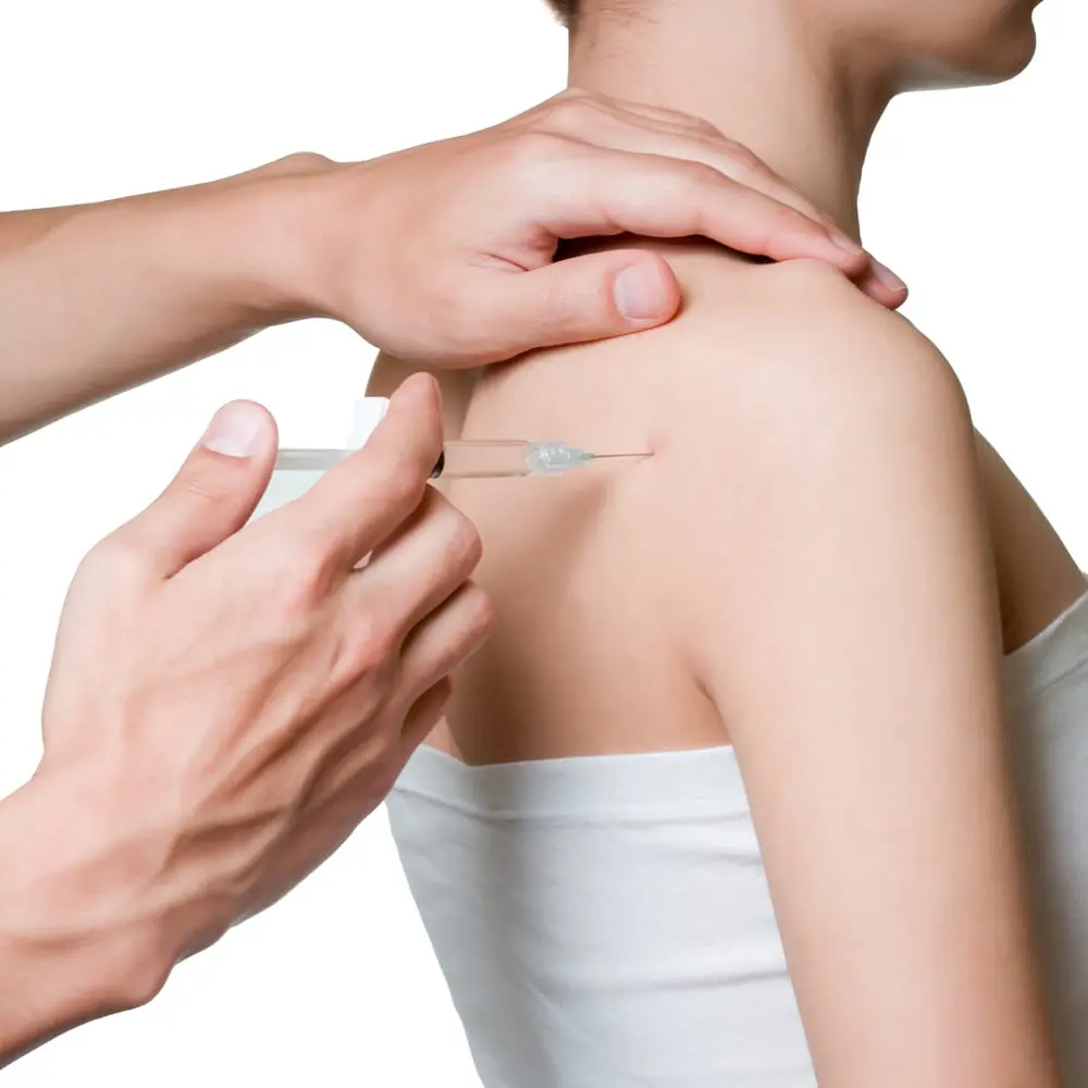 female patient's back getting injection