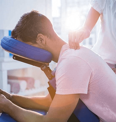 Young male receiving chiropractic treatment at Core Health Chiropractor