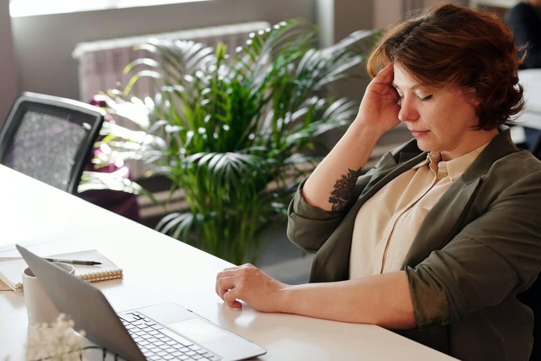 Woman doing desk work losing focus