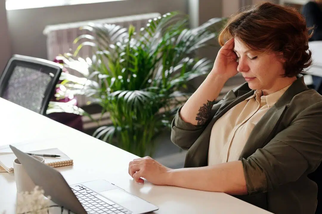 Woman doing desk work losing focus