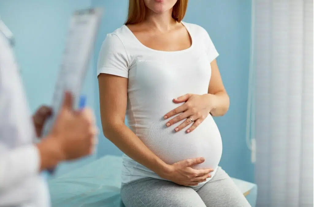 Pregnant woman consulting a chiropractor