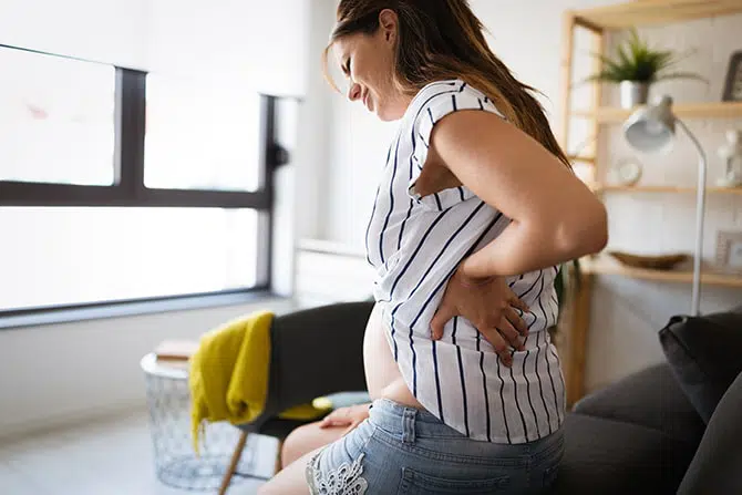 Pregnant woman experiencing pain