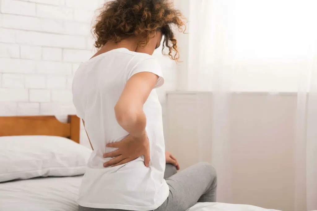 patient suffering from lower back pain from pelvic floor problems