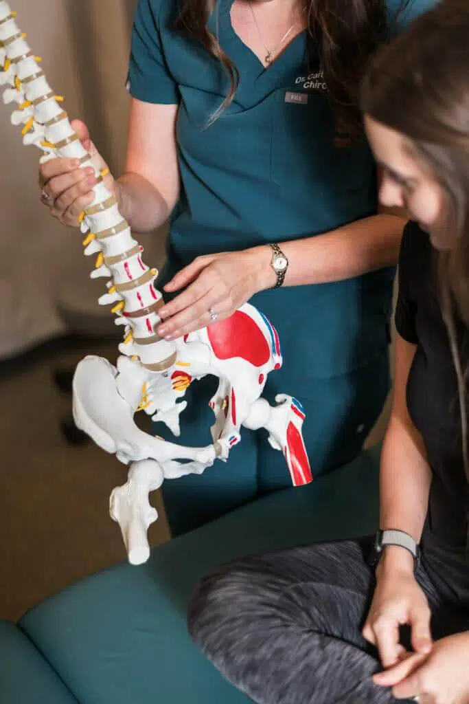 Chiropractor explaining what is Herniated Disc to the patient