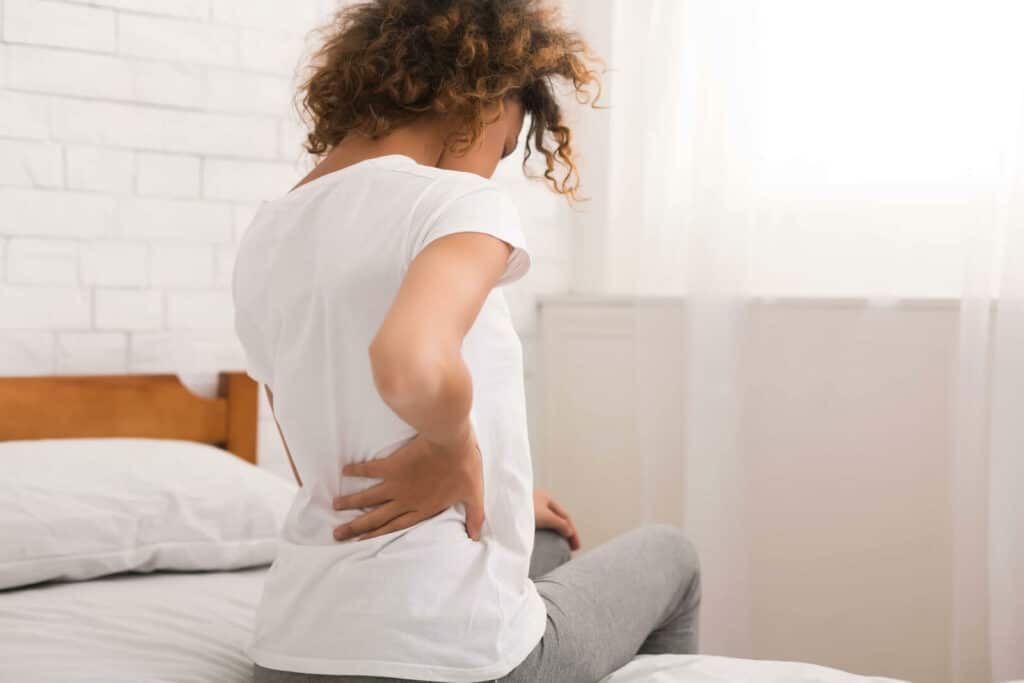 Patient suffering from back pain because of Herniated Disc 