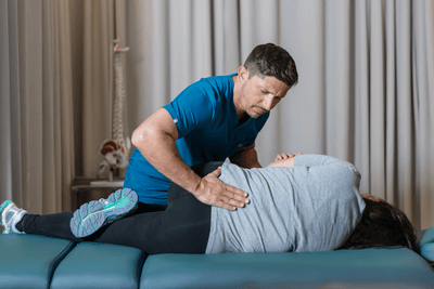 Chiropractor doing the chiropractic adjustments to the patient
