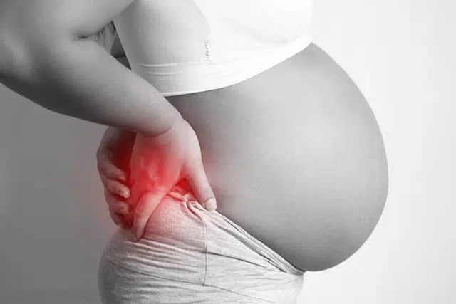 Pregnant woman suffering from pinched nerve