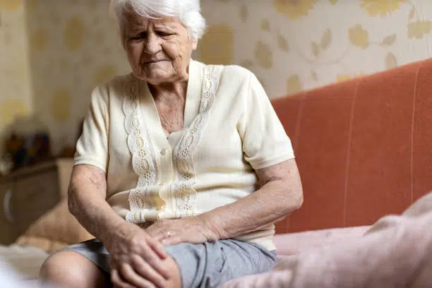Senior woman suffering from joint stiffness cause by Arthritis