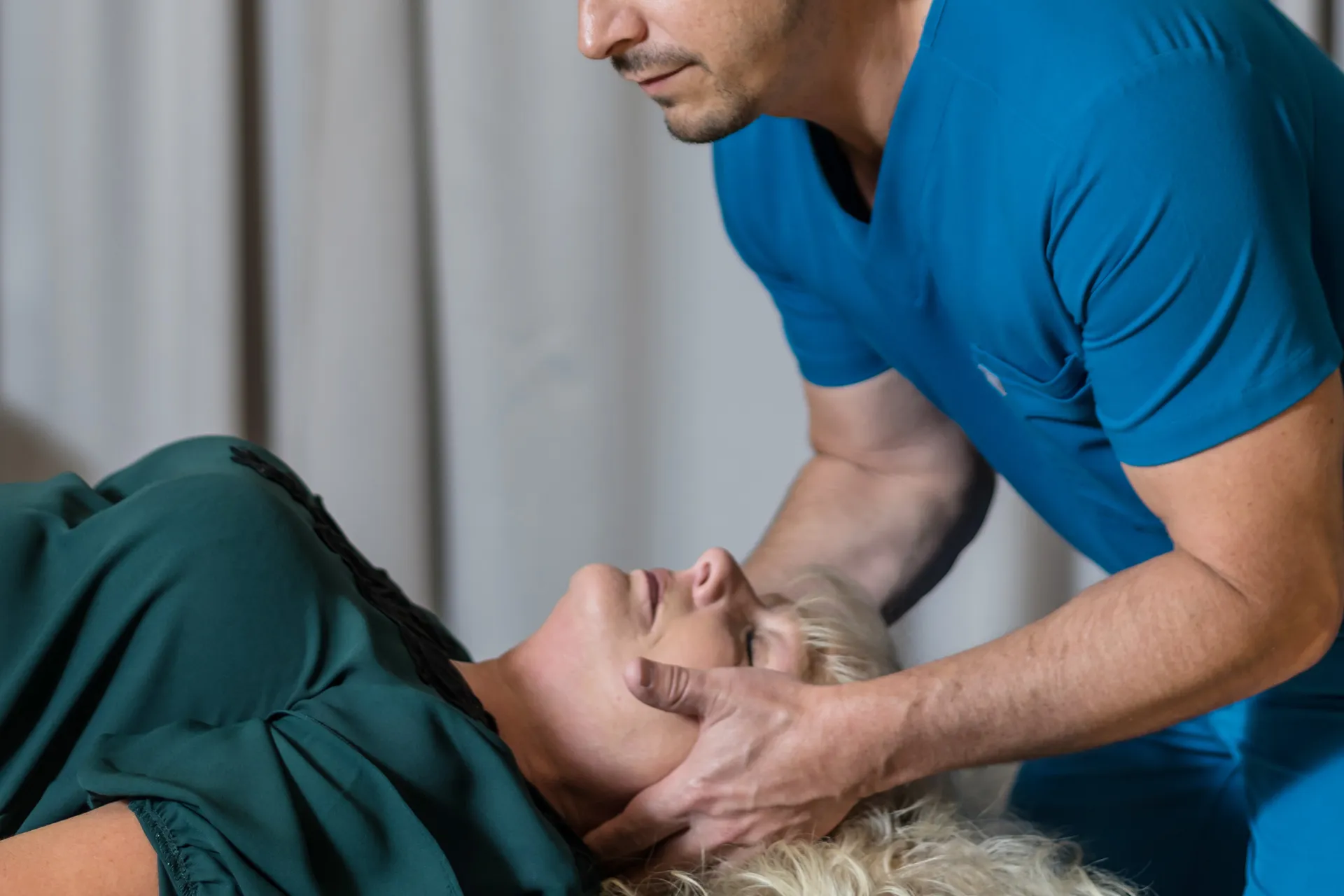 Chiropractor treating a patient's neck