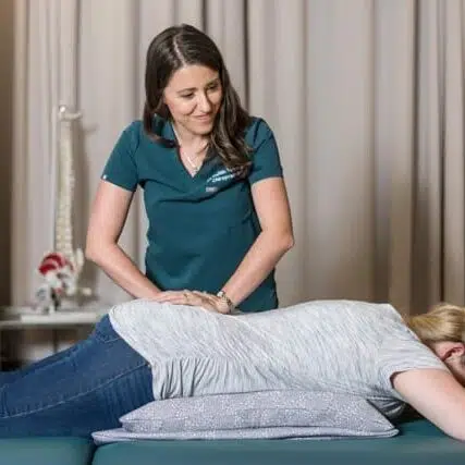 Chiropractor doing some chiropractic adjustment to the patient at  Core Health Spine & Rehabilitation