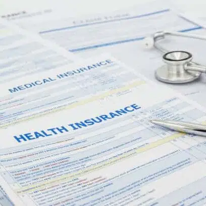 health insurance form and stethoscope medical concept