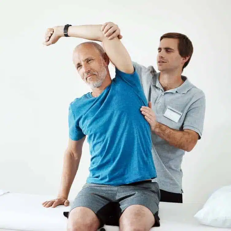 physiotherapist evaluating a patients body.