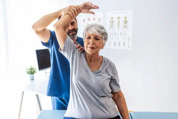 osteopath helping the patient to under go in physical therapy.