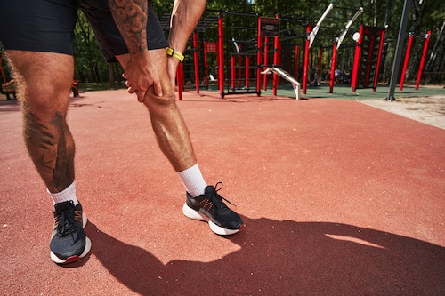 Athletic-man-suffering-from-injury-during-training