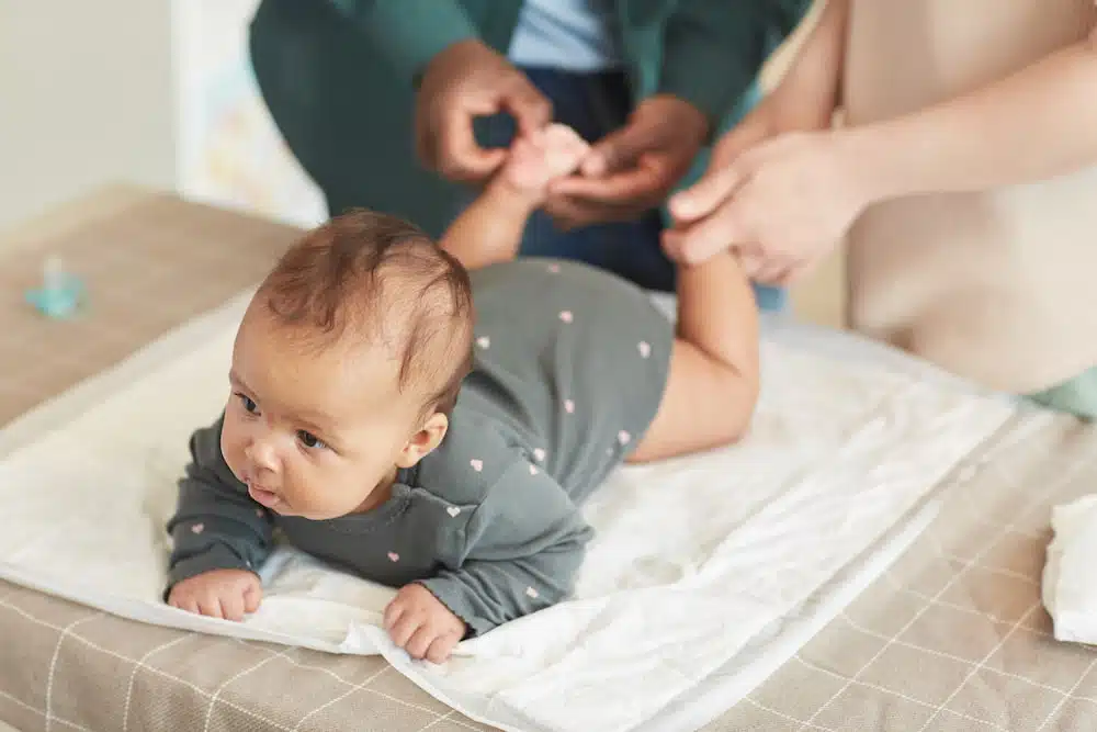 newborn baby getting treatment for  chiropractic care 