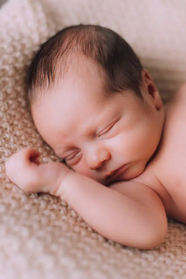 Improved Sleeping Patterns of a newborn baby sleeping after getting chiropractic care