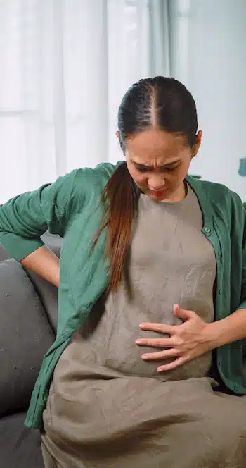 mother Seeking Prenatal Pain Relief with her pregnancy discomfort