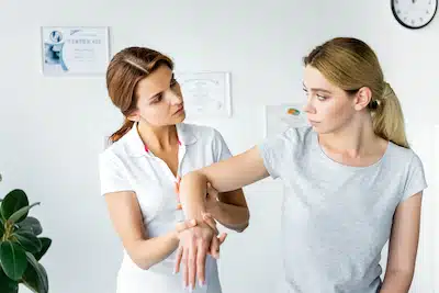 chiropractor treating patient's Wrist for Pain Relief 