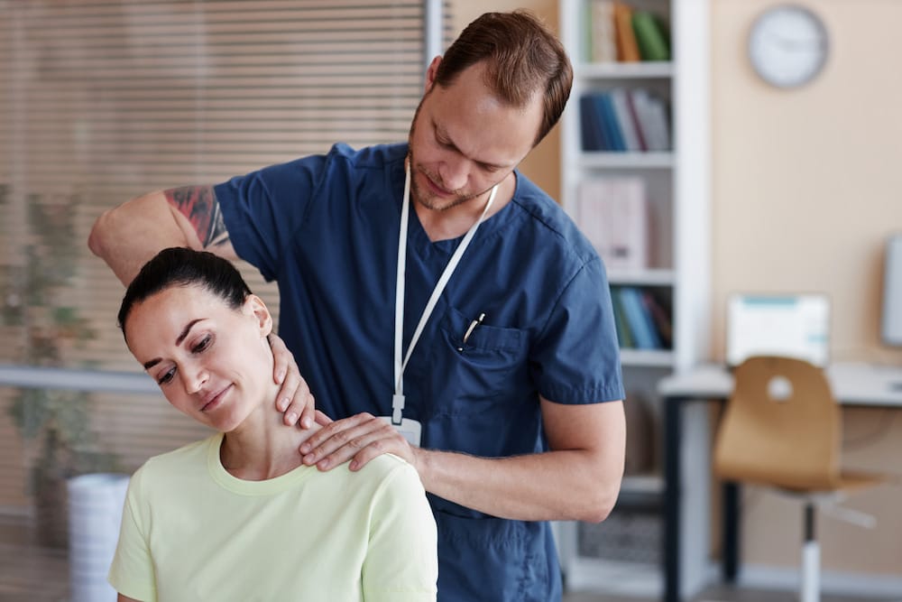 Therapist doing massage to patient