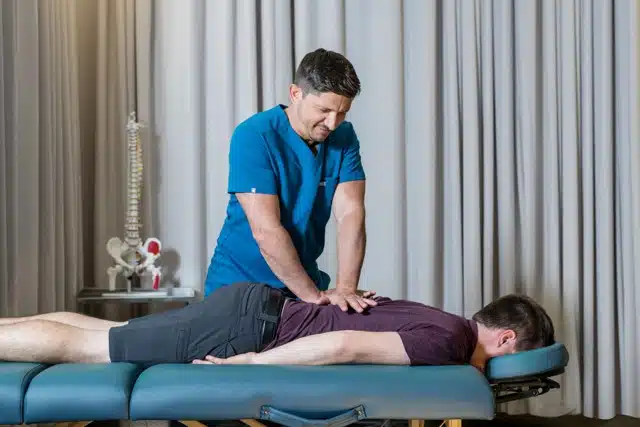 chiropractor with a patient