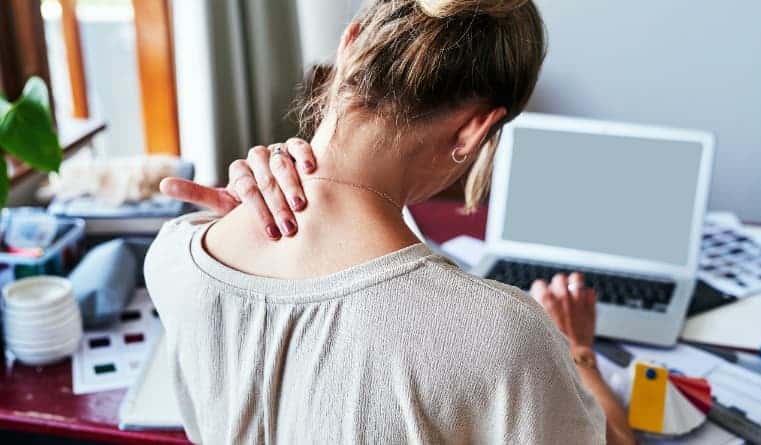 Woman doing daily work has a stiff neck