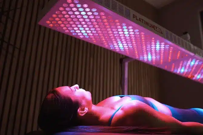 Woman laying down and having redlight therapy